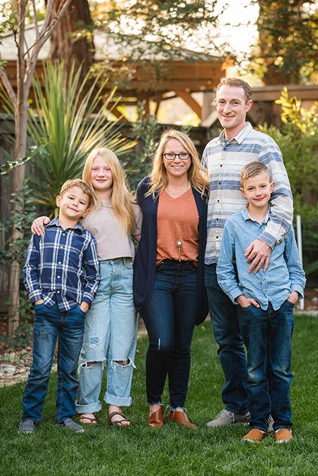 A group of people smiling and posing together for a photo.